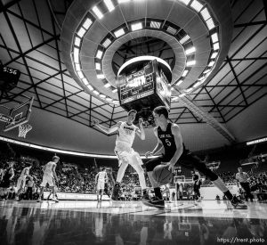 Trent Nelson  |  The Salt Lake Tribune
Lone Peak's Max Brenchley (5) drives into Bingham's Branden Carlson (35) as Bingham faces Lone Peak in the 5A state high school basketball championship game, Saturday March 4, 2017.