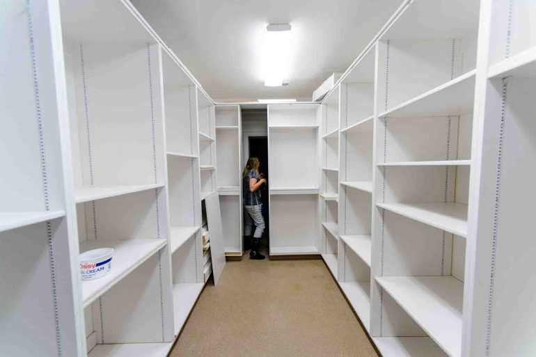 Trent Nelson  |  The Salt Lake Tribune
Brielle Decker opens up a hidden door leading to a secret chamber at the former home of Warren Jeffs in Hildale, Wednesday April 5, 2017.