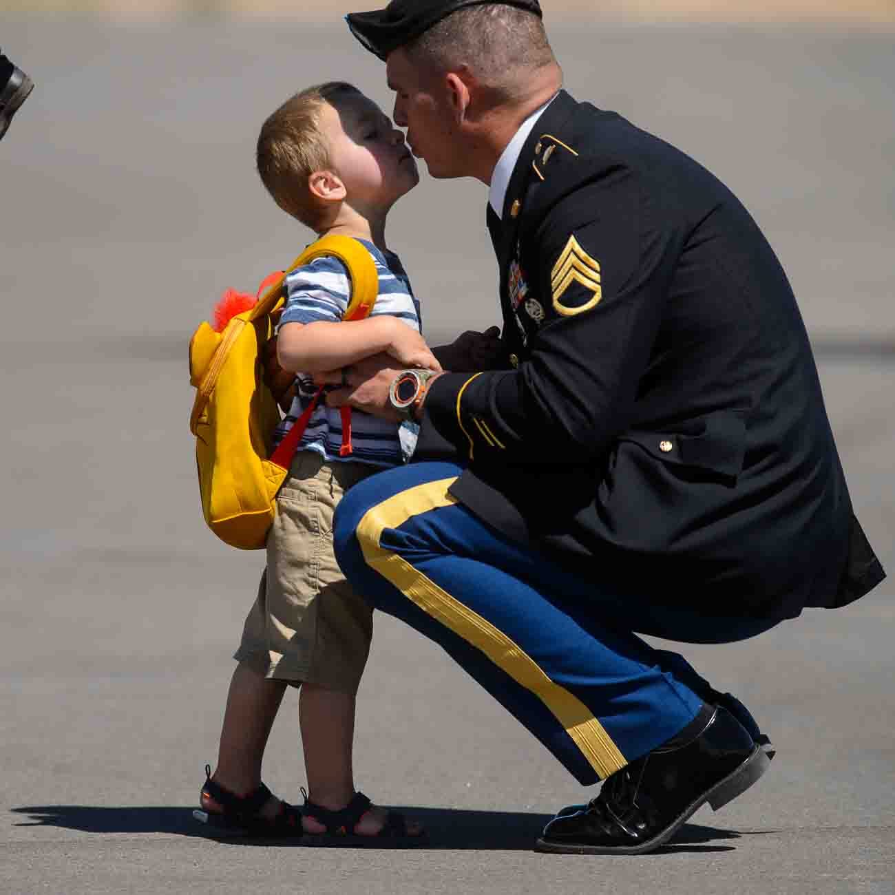 (Trent Nelson | The Salt Lake Tribune)  Robert Barton kisses his father, Jesse Barton (cousin of Aaron Butler) while waiting for the arrival the body of fallen soldier Aaron Butler, who was killed last week in Afghanistan, at the Monticello Airport, Thursday August 24, 2017.