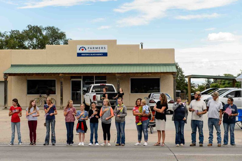 (Trent Nelson | The Salt Lake Tribune)  Crowds line Main Street in Monticello to honor the motorcade of fallen soldier Aaron Butler, who was killed last week in Afghanistan, , Thursday August 24, 2017.