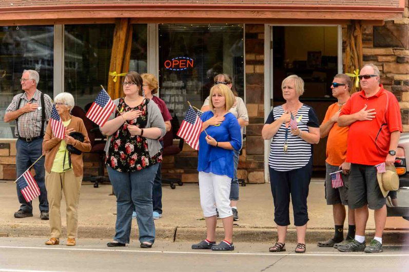 (Trent Nelson | The Salt Lake Tribune)  Crowds line Main Street in Monticello to honor the motorcade of fallen soldier Aaron Butler, who was killed last week in Afghanistan, , Thursday August 24, 2017.