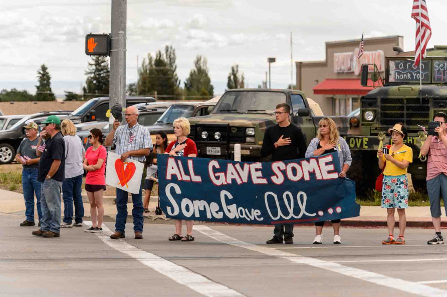 (Trent Nelson | The Salt Lake Tribune)  Crowds line Main Street in Monticello to honor the motorcade of fallen soldier Aaron Butler, who was killed last week in Afghanistan, , Thursday August 24, 2017.