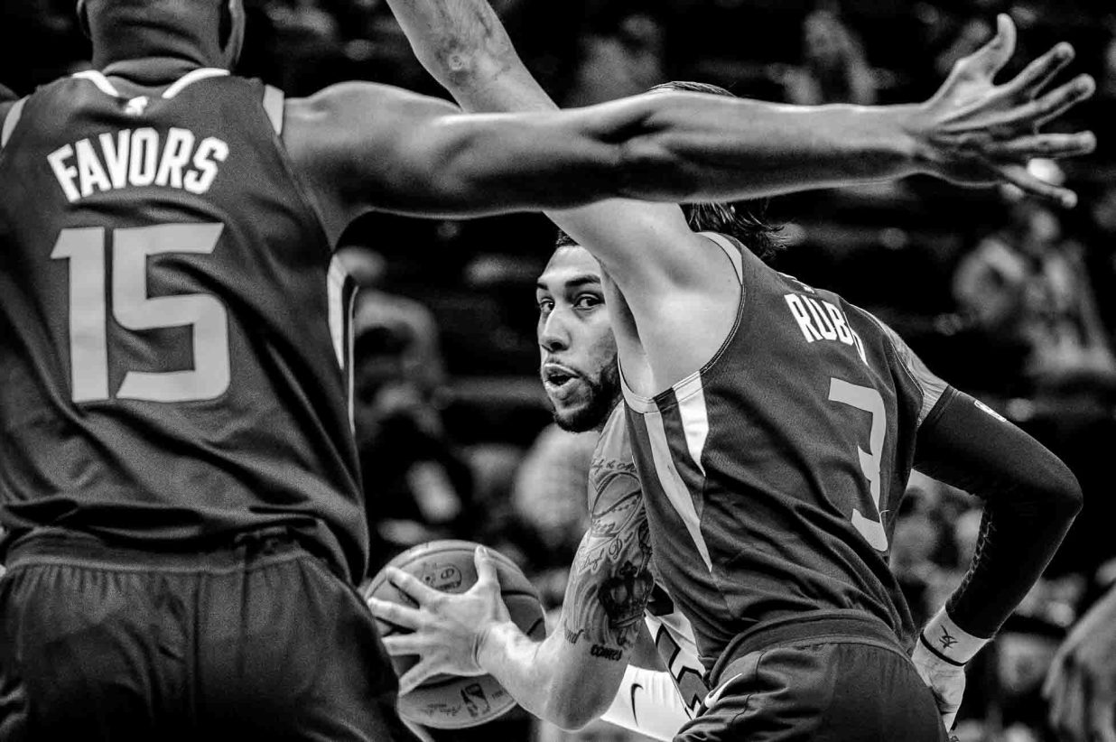 Chicago Bulls forward Denzel Valentine (45) is defended by Utah Jazz forward Derrick Favors (15) and Utah Jazz guard Ricky Rubio (3) as the Utah Jazz host the Chicago Bulls, NBA basketball in Salt Lake City Wednesday November 22, 2017.