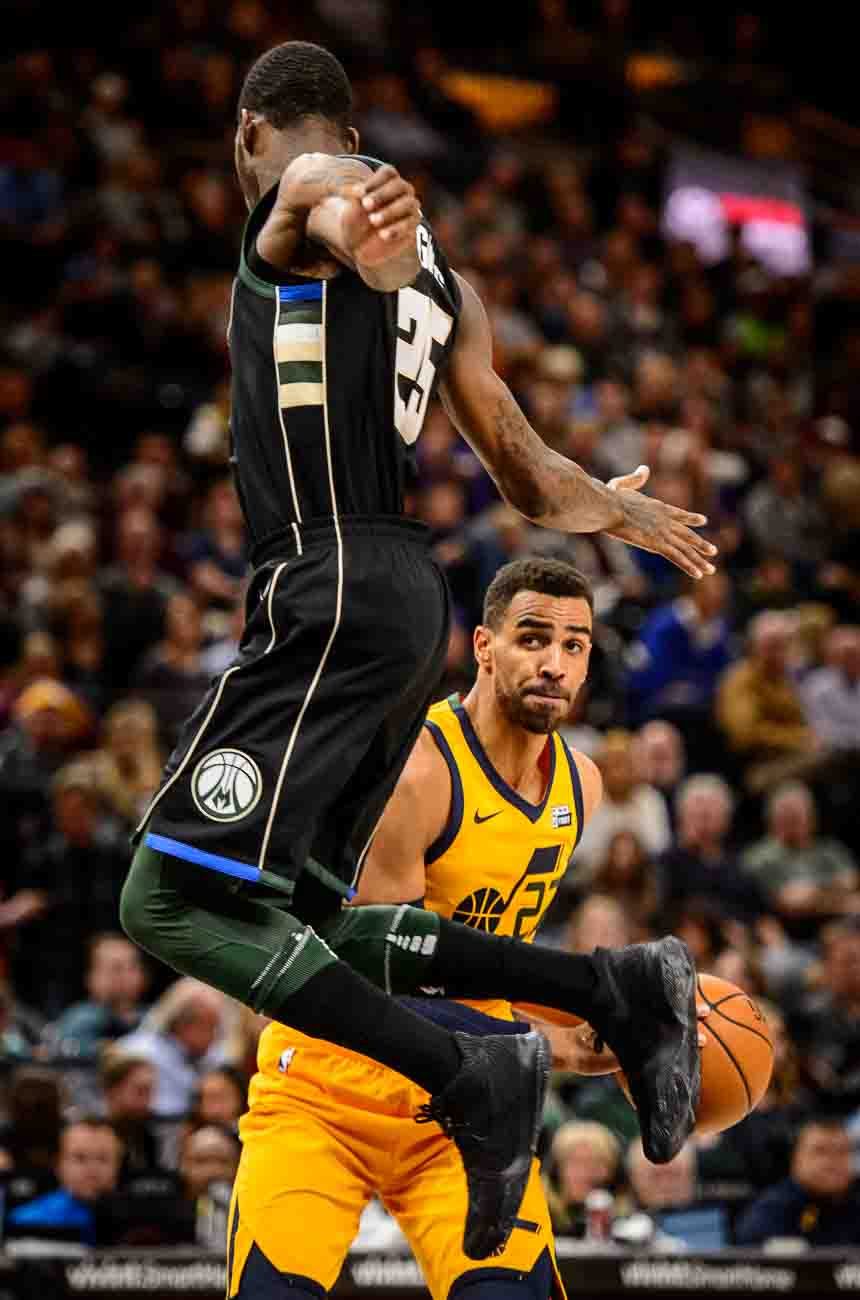 Utah Jazz forward Thabo Sefolosha (22) defended by Milwaukee Bucks guard DeAndre Liggins (25) as the Utah Jazz host the Milwaukee Bucks, NBA basketball in Salt Lake City Saturday November 25, 2017.