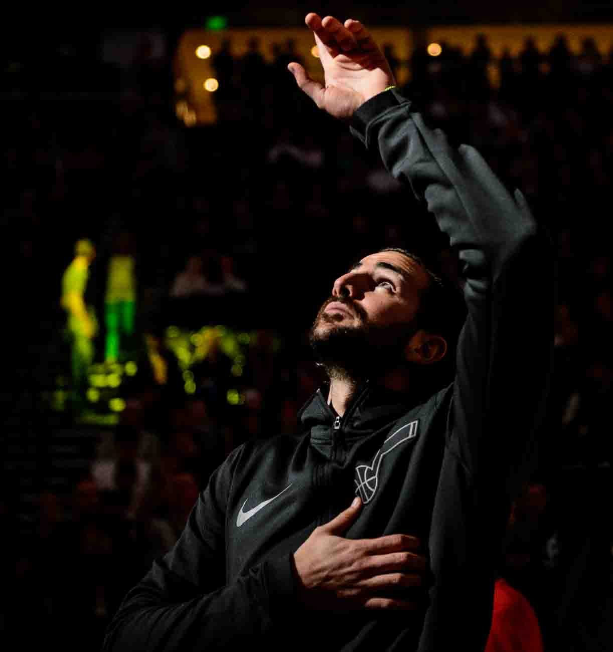 Utah Jazz guard Ricky Rubio (3) points up during player introductions jas the Utah Jazz host the Milwaukee Bucks, NBA basketball in Salt Lake City Saturday November 25, 2017.