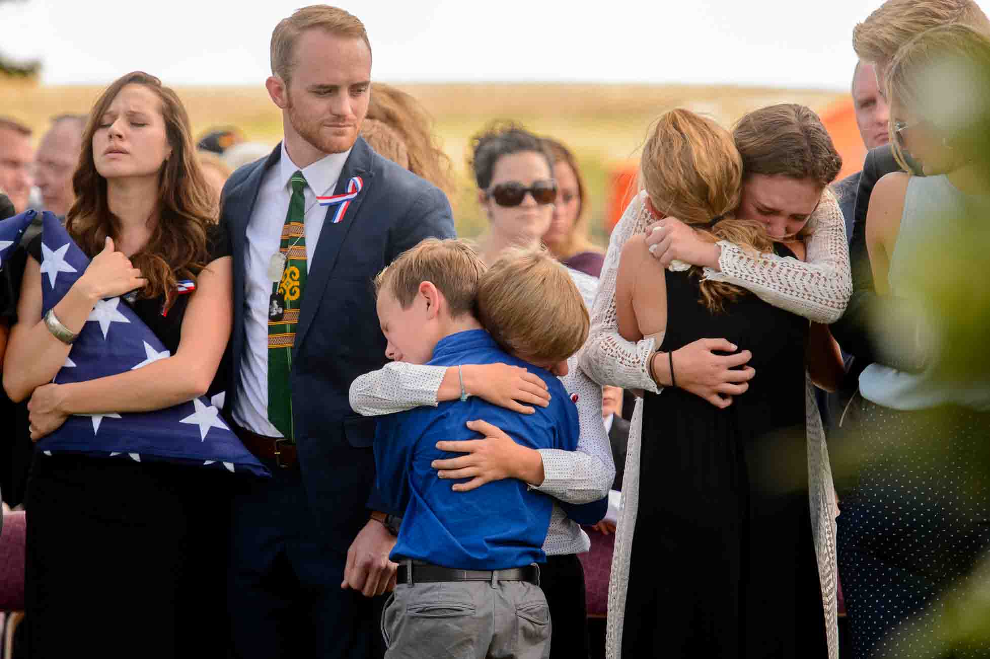 (Trent Nelson | The Salt Lake Tribune)  Family members grieve at the graveside service for fallen soldier Aaron Butler, in Monticello Saturday August 26, 2017. At left is Alexandria Seagroves, Butler's fiancé.