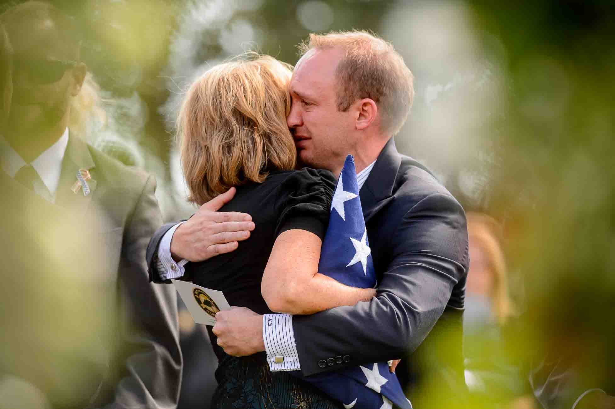 (Trent Nelson | The Salt Lake Tribune)  Laura Butler embraces her son Nathan after the graveside service for one of her other sons, fallen soldier Aaron Butler, in Monticello Saturday August 26, 2017.