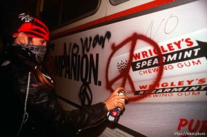 Spray painting a bus during Anti war Gulf War protests.