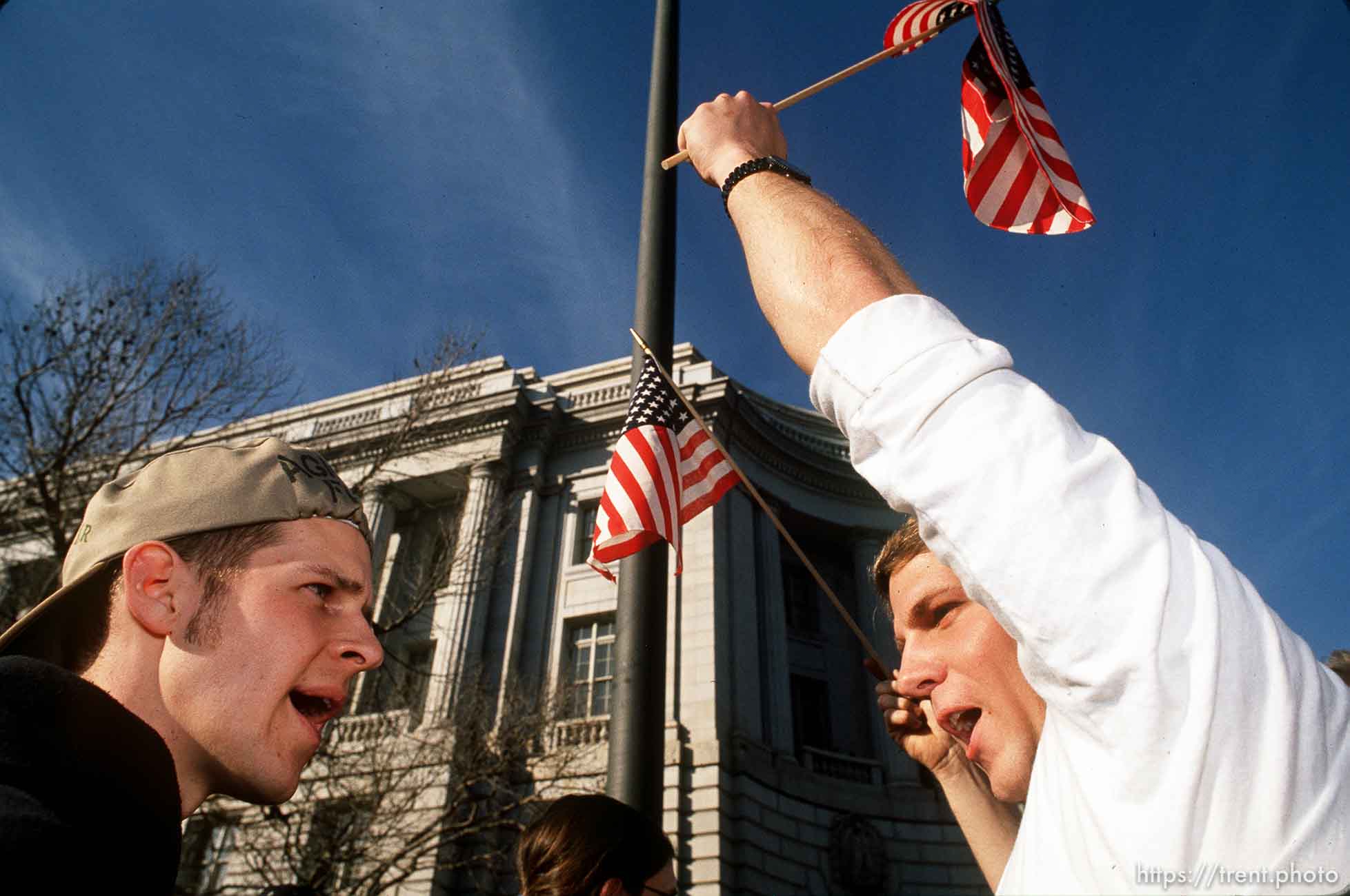 War protester and war supporter argue at Gulf War protest.