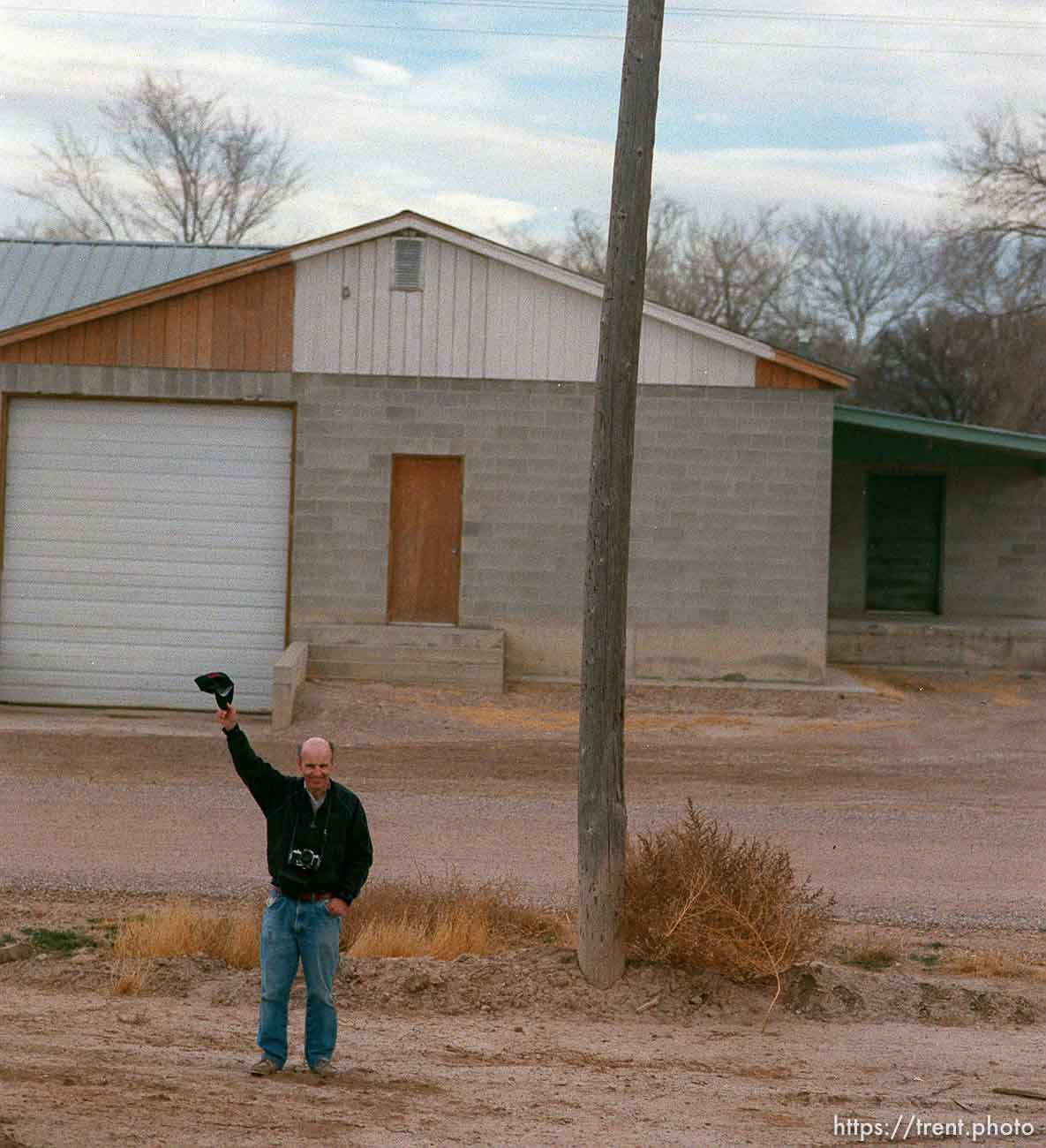 Man waves to the Governor's Centennial Train