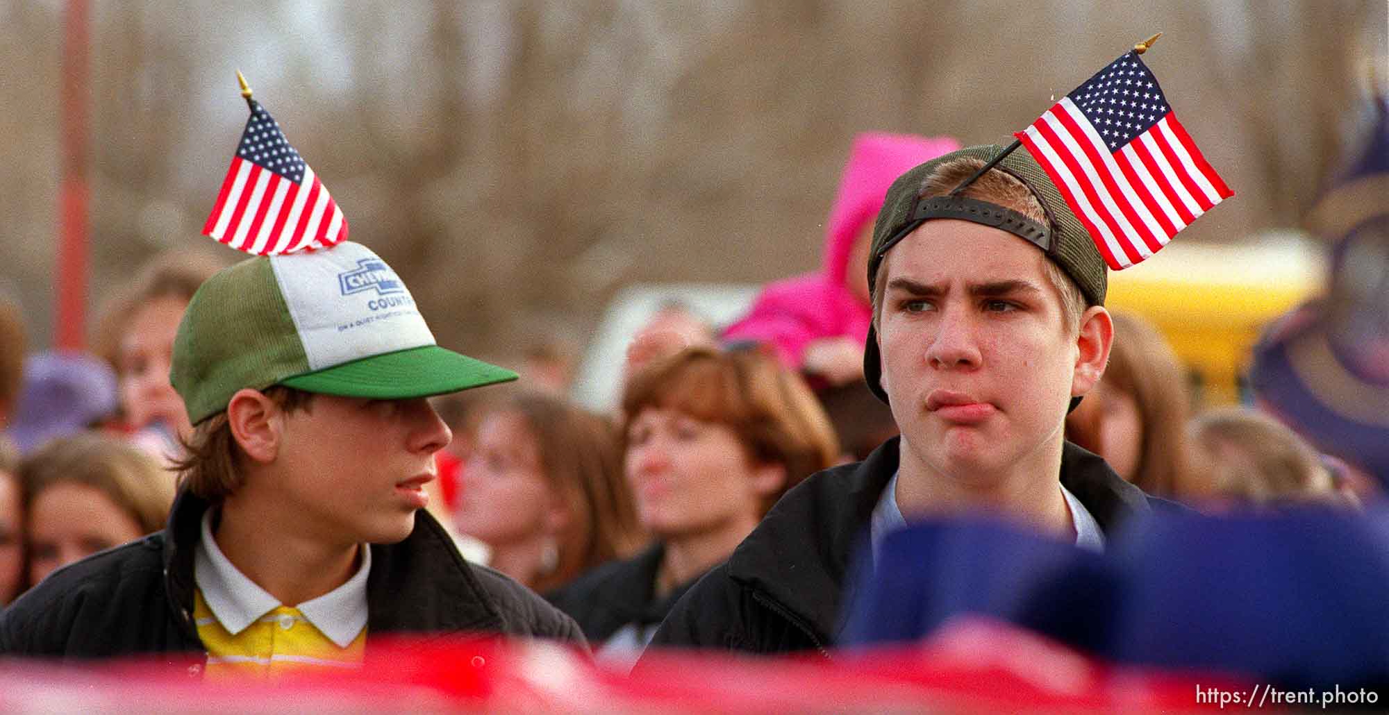 Two  kids with flags on their hats out to see the Governor's Centennial Train