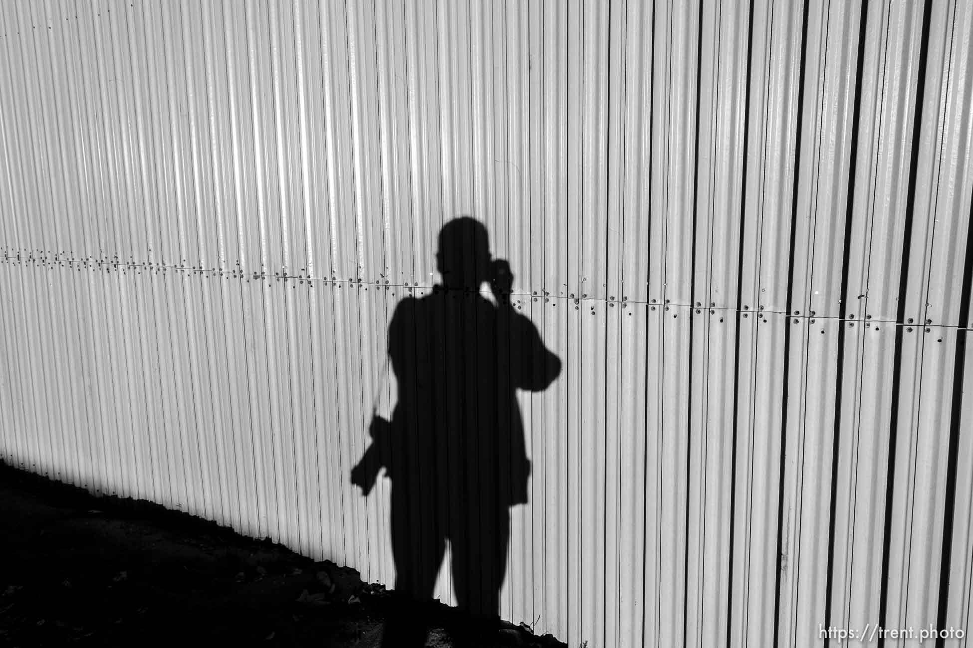 Trent Nelson  |  The Salt Lake Tribune
trent shadow and wall around apparent new FLDS storehouse, Hildale, Wednesday January 14, 2015.