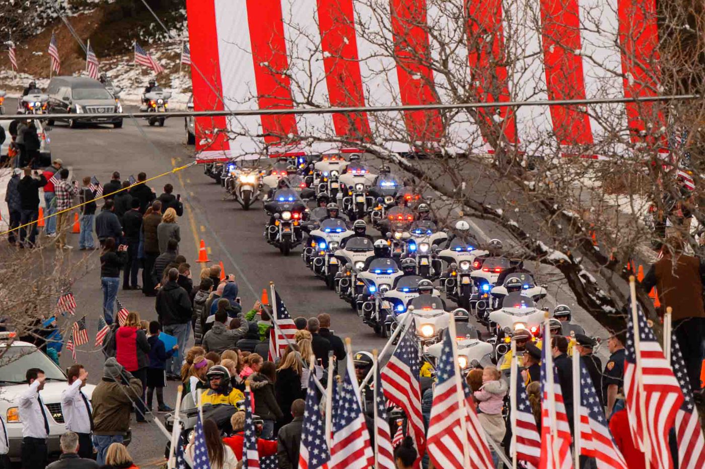 Trent Nelson  |  The Salt Lake Tribune
A long motorcade makes its way to the Orem City Cemetery Monday January 25, 2016, for the graveside service for Officer Douglas Scott Barney, who was fatally shot by Corey Lee Henderson following a car crash in Holladay on January 17.