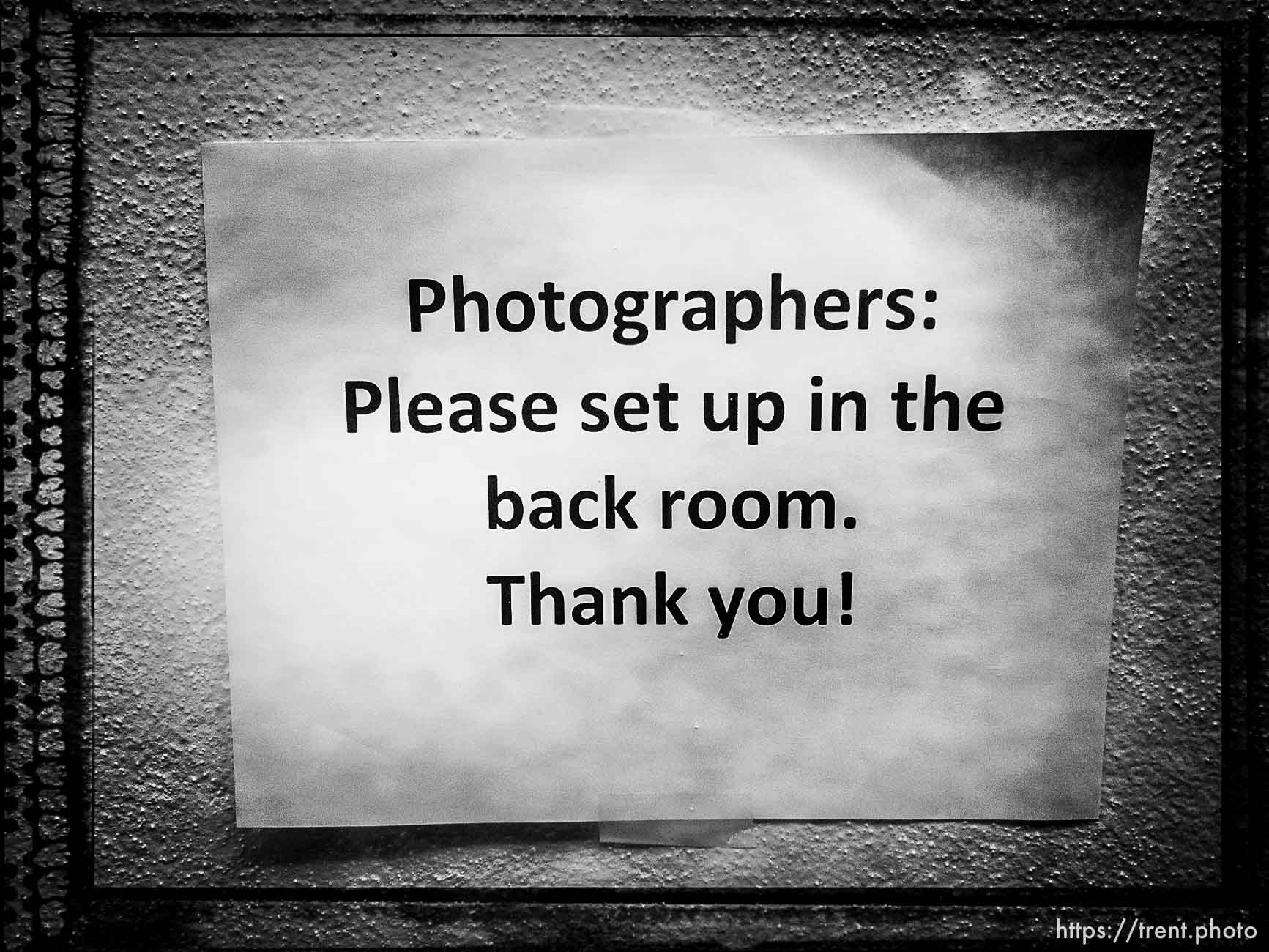 Photographers to the back