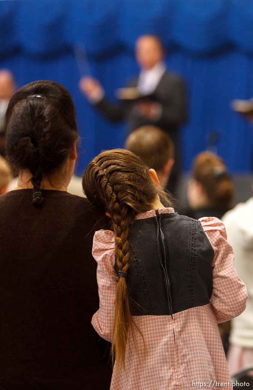 Trent Nelson  |  The Salt Lake Tribune
A young girl rests her head on her mother's shoulder during a church service of ex-FLDS members Sunday, February 17, 2013 in Hildale.