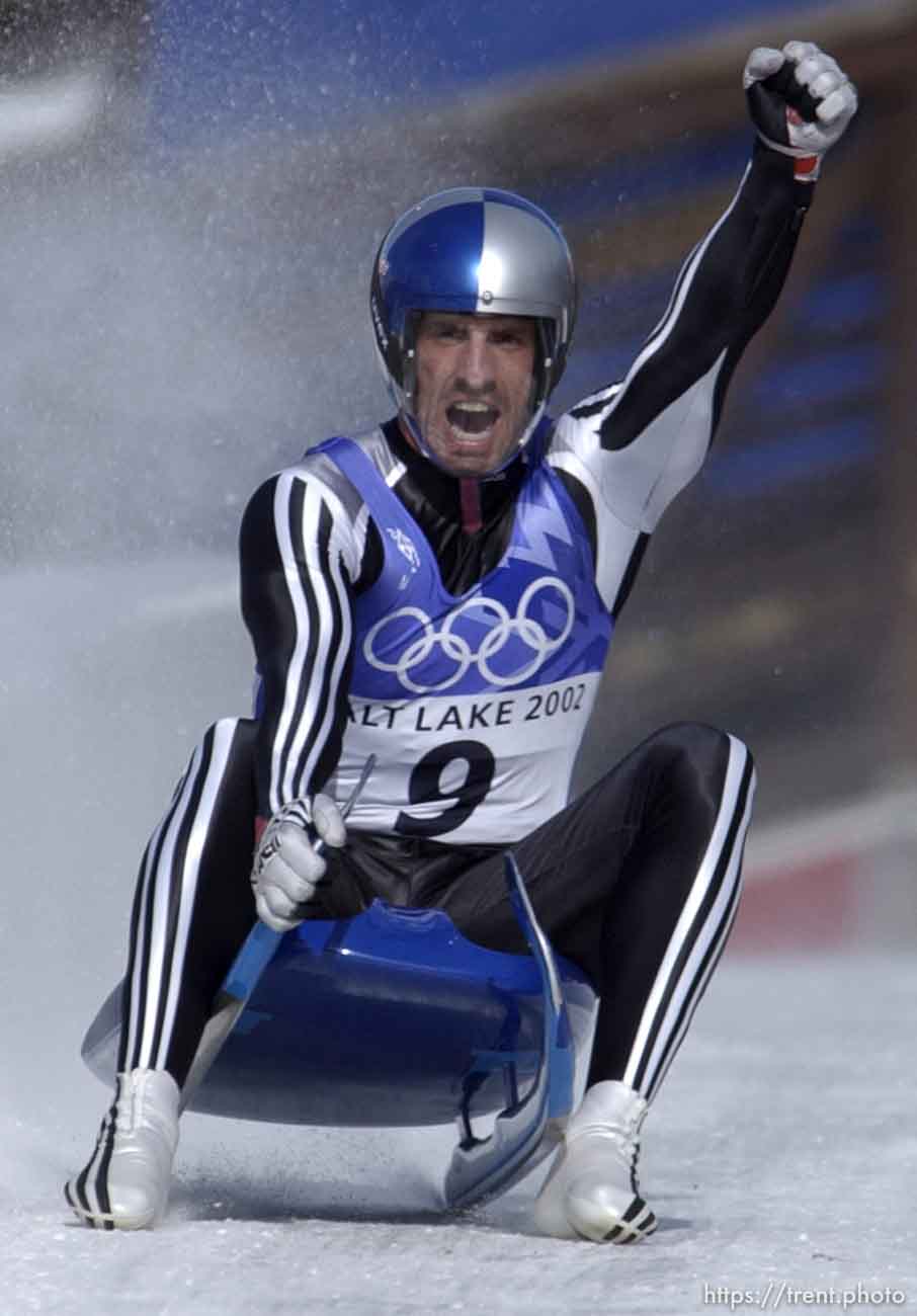 Austria's Markus Prock pumps his fist at the end of his final run, securing the bronze medal in Men's Luge. Final round, Mens Luge, Monday morning at the Utah Olympic Park, 2002 Olympic Winter Games.
Photo by Trent Nelson 02.11.2002, 12:56:26 PM