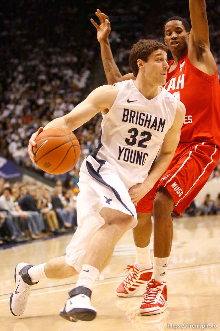 Trent Nelson  |  The Salt Lake Tribune
BYU's Jimmer Fredette drives past Utah's Will Clyburn in the first half at BYU vs. Utah, college basketball in Provo, Utah, Saturday, February 12, 2011.