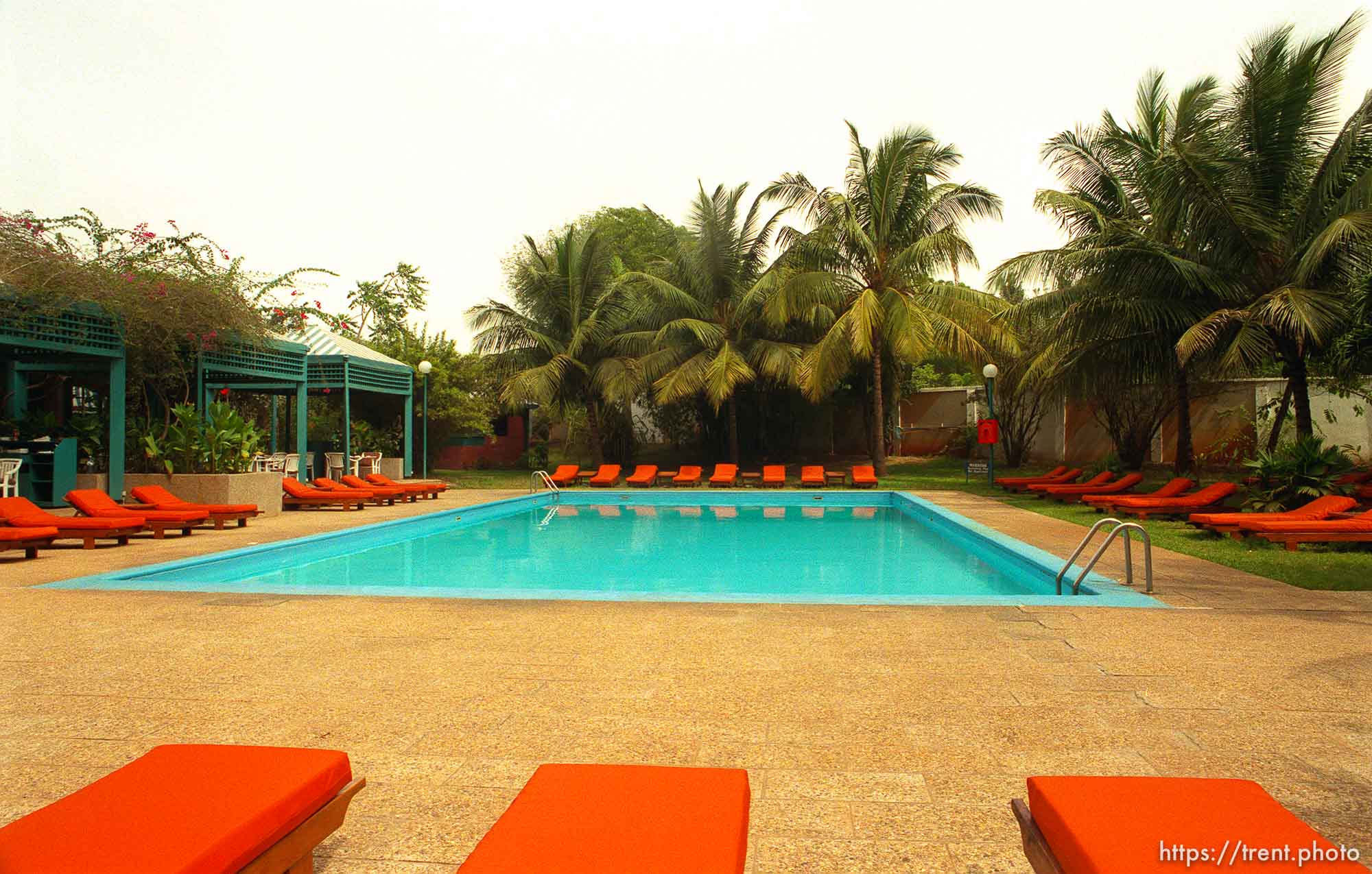 Pool and orange deck chairs at the Novatel Hotel.