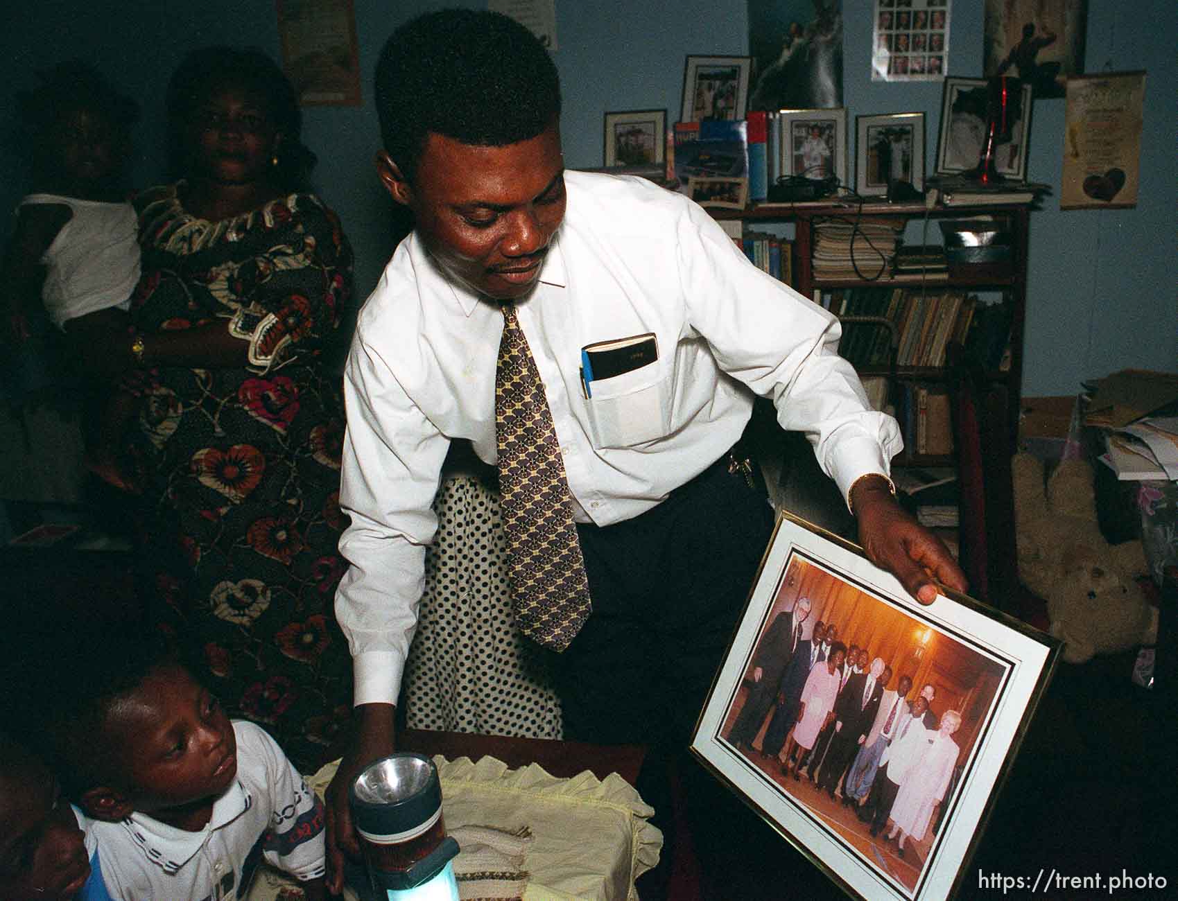 Ben Ntiamoah shows a picture of himself and LDS president Gordon B. Hinckley at Ben Ntiamoah's house