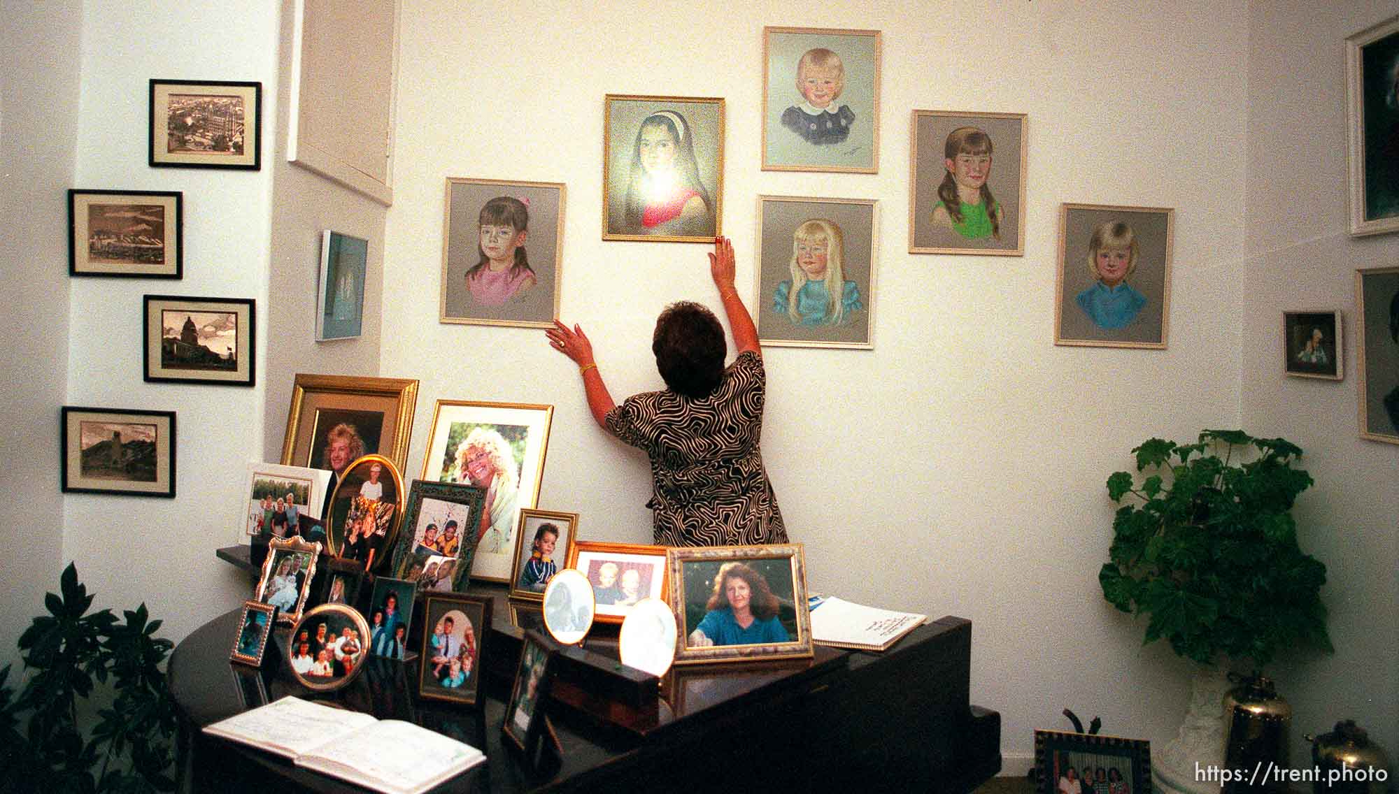 Iris Nield adjusts a portrait of one of her six daughters.