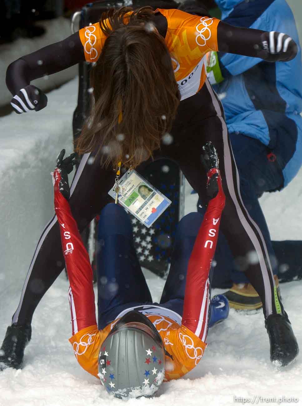 USA skeleton athletes Lea Ann Parsley (top, silver medalist) and Tristan Gale (gold medalist) celebrate. Skeleton, Wednesday morning at the Utah Olympic Park, 2002 Olympic Winter Games.; 02.20.2002, 11:56:56 AM