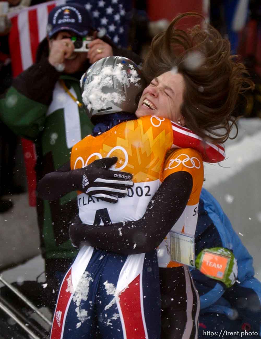 USA skeleton athletes Lea Ann Parsley (top, silver medalist) and Tristan Gale (gold medalist) celebrate. Skeleton, Wednesday morning at the Utah Olympic Park, 2002 Olympic Winter Games.; 02.20.2002, 11:56:59 AM