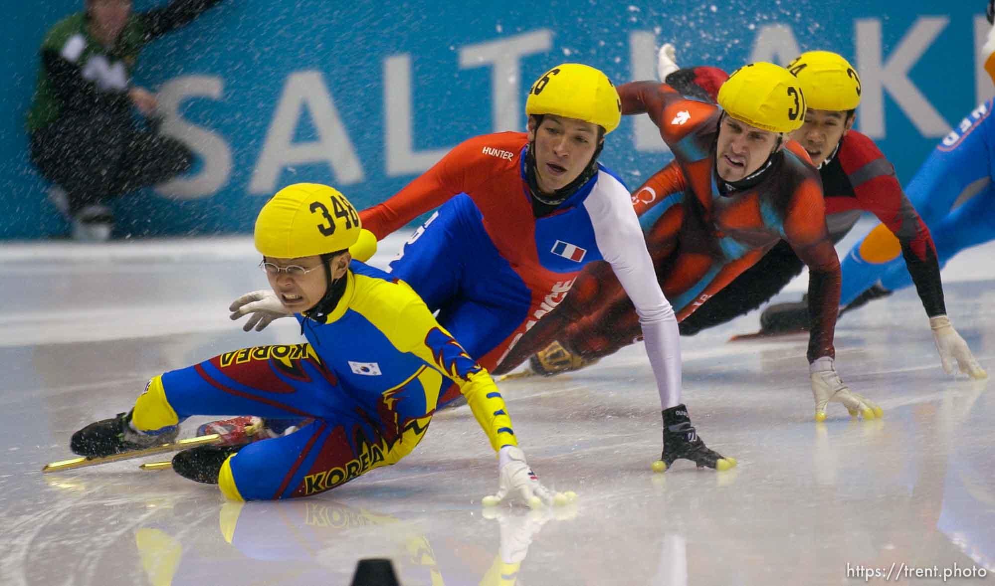 Korean Ahn Hyun-Soo  slides out of control. From left, France's Gregory Durand, Canadian Marc Gagnon, and China's Li Jiajun. Mens 1500m qualifying rounds, Wednesday evening at the Salt Lake Ice Center, 2002 Olympic Winter Games.
 02.20.2002, 8:00:49 PM