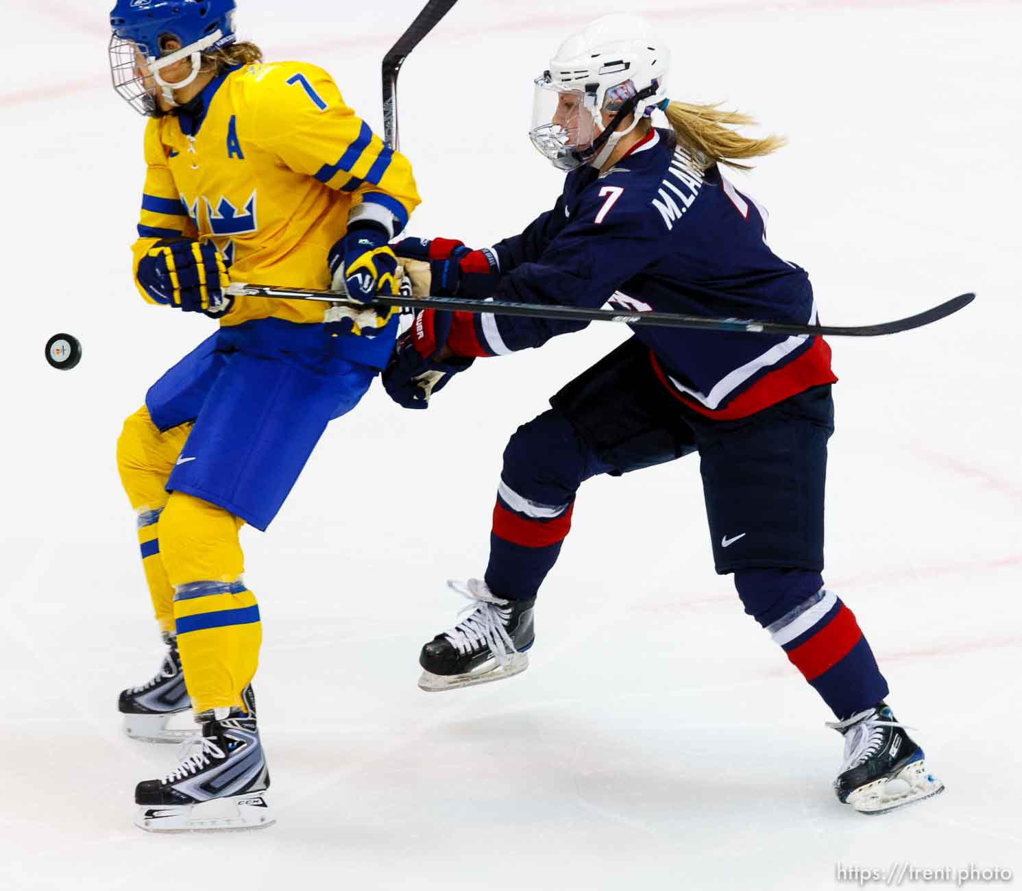 USA vs. Sweden, women's hockey, at the XXI Olympic Winter Games in Vancouver, Monday, February 22, 2010. USA's Monique Lamoureux, Sweden's Maria Rooth