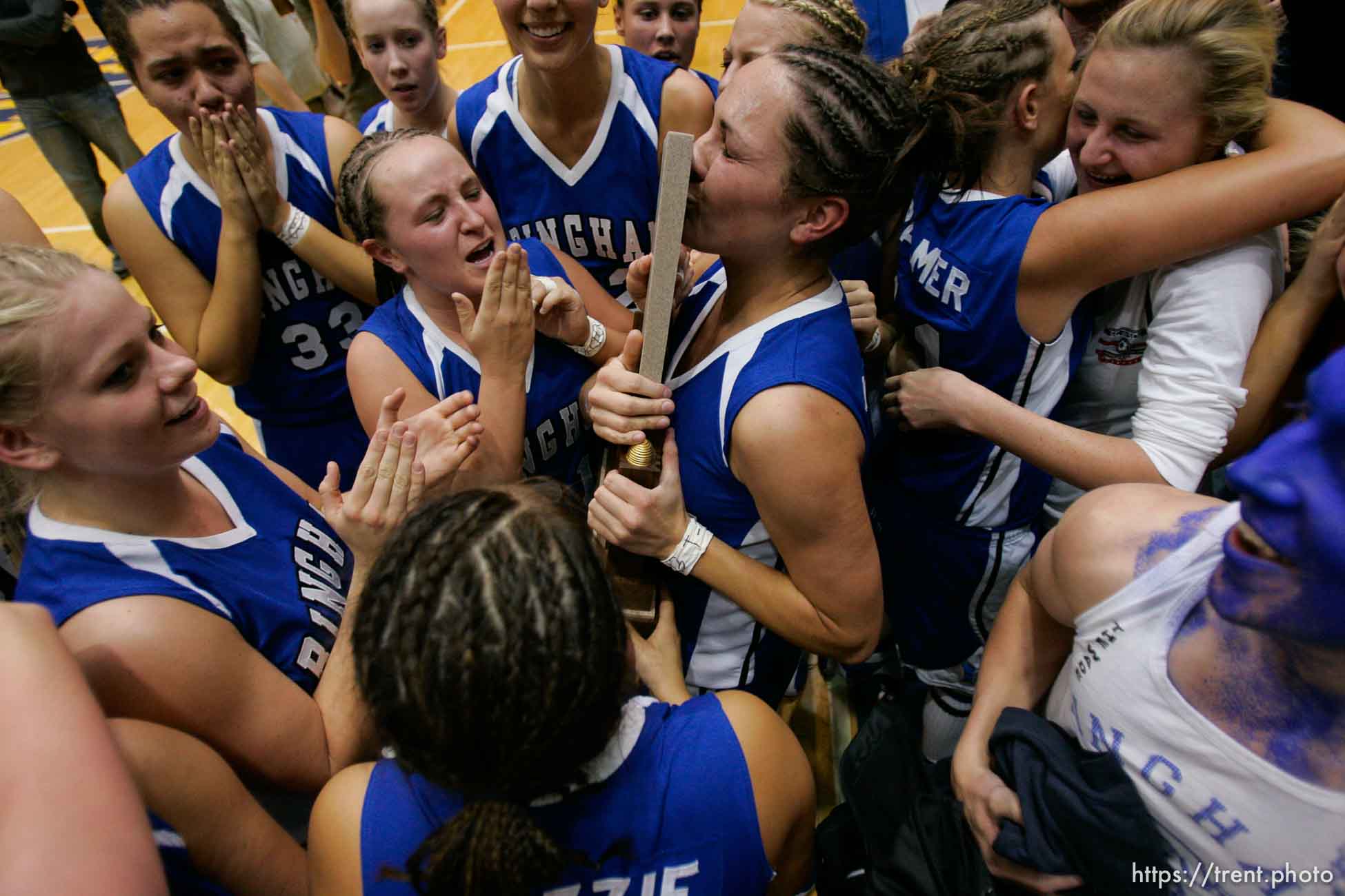 Bingham's Lexe Jacobs kisses the state championship trophy. Taylorsville - Bingham wins the state championship. Bingham vs. Skyline High School, 5A Girls State Basketball Championship game at Salt Lake Community College.