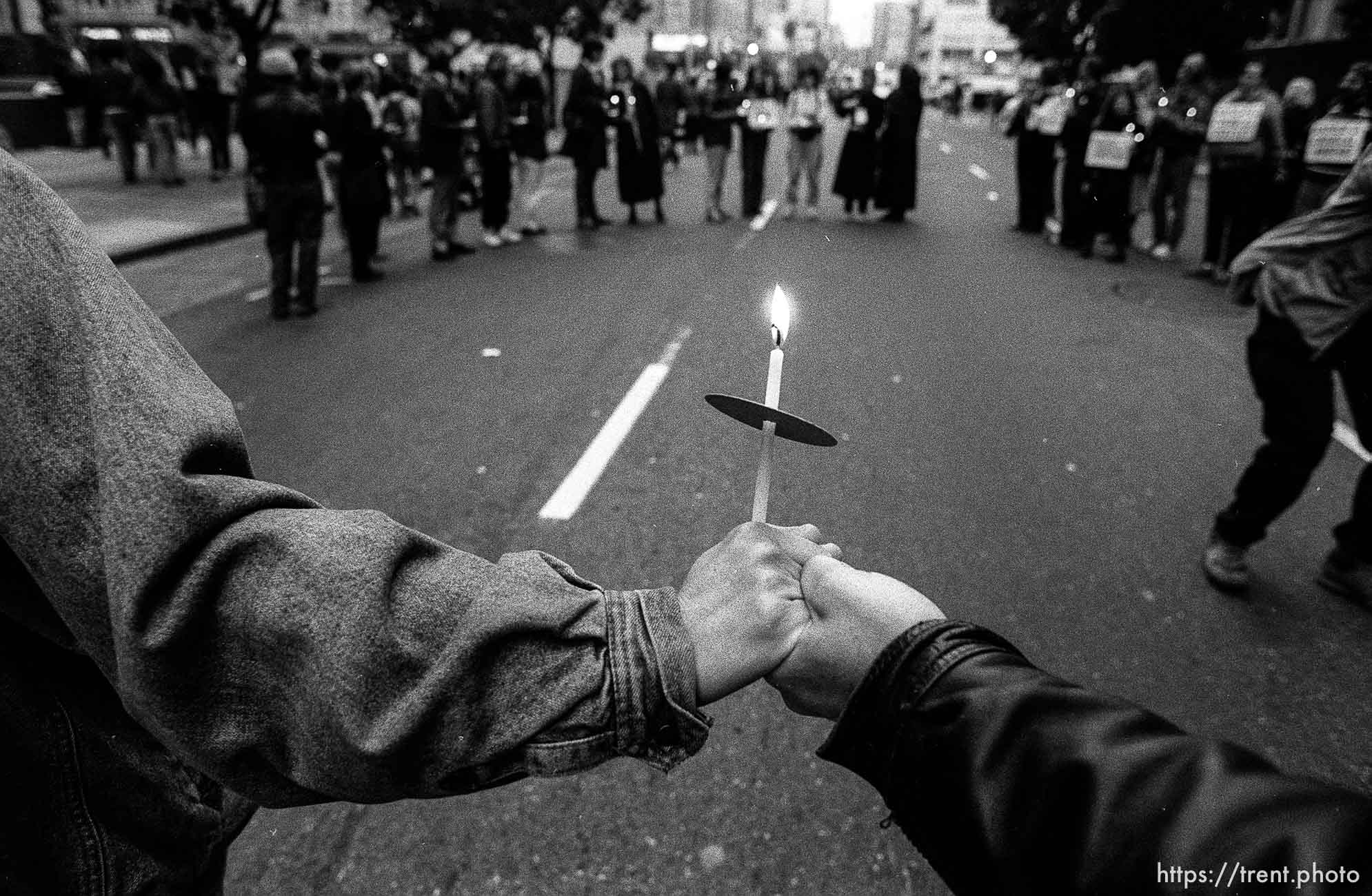 Protesters hold hands and candles at Gulf War protest Federal Building blockade