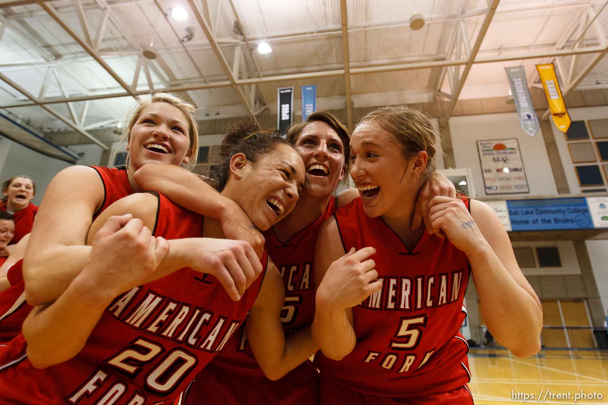 Taylorsville - American Fork's Cydne Mason (3), American Fork's Nikky Ybarra (20), American Fork's Amy Krommenhoek (25), and American Fork's Haley Holmstead (5) celebrate their championship win. Riverton vs. American Fork High School girls basketball, 5A State Championship game Saturday February 28, 2009 at Salt Lake Community College.