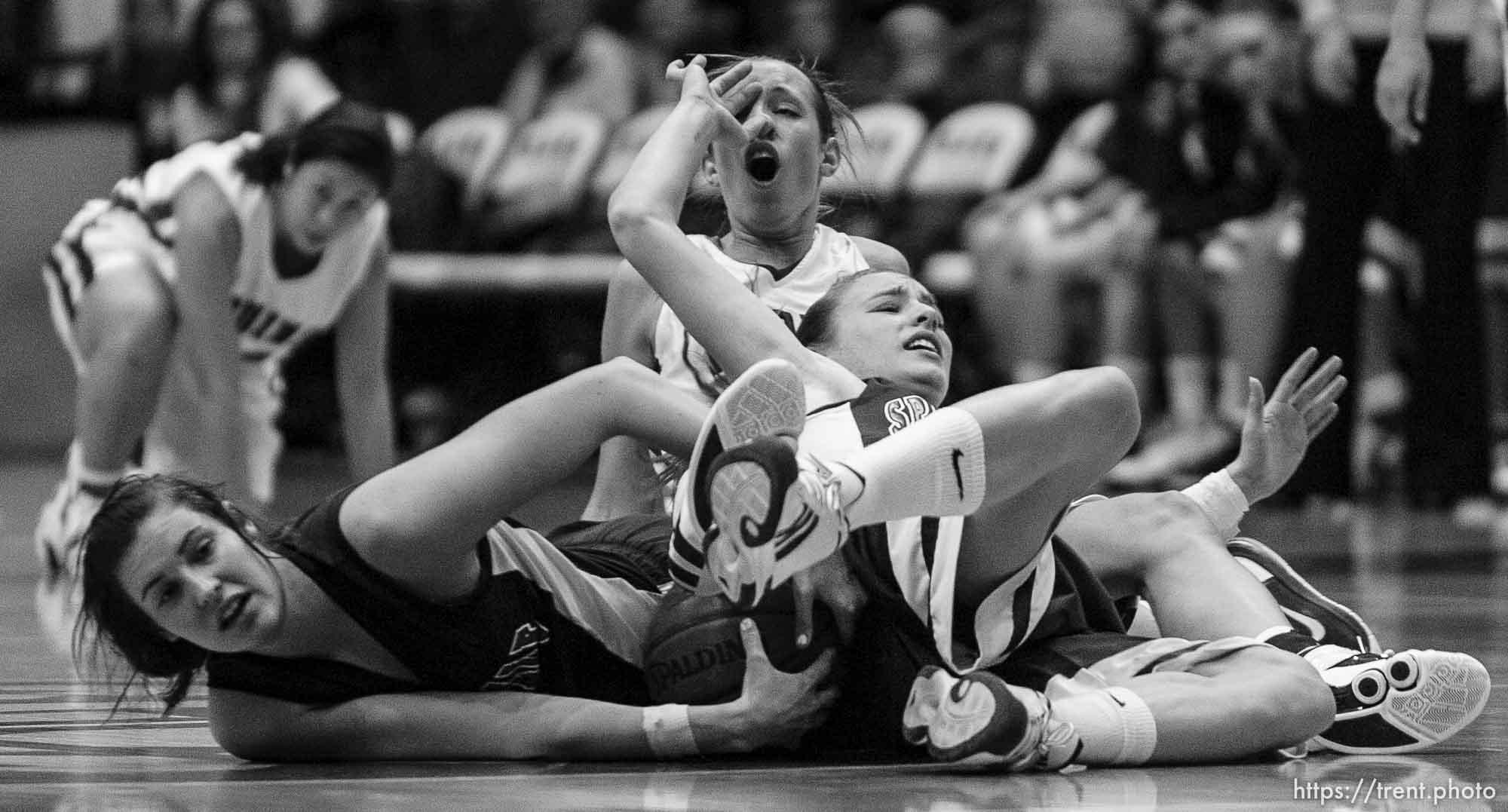 Taylorsville - Springville's Jessica Jensen (10, left) and Springville's Lexi Eaton (5) and Mountain View's Anjie Lines (30, rear) in a scramble. Mountain View vs. Springville High School girls basketball, 4A State Championship game Saturday February 28, 2009 at Salt Lake Community College.