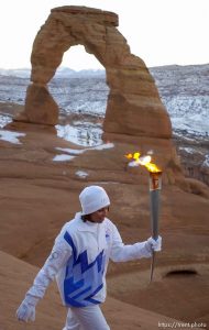 The Olympic Torch arrives in Utah, beginning with a sunrise ceremony and blessing performed by Frank Arrowchis, a member of the Whiteriver band of the Northern Ute Indian Tribe. Arrowchis then handed to torch to his 16-year-old granddaughter, Stephanie Laree Spann. At Balanced Rock, Natalie Hettman took the torch by bike, after a Torch Relay Official removed the hula girl from the handlebars of the bike. 02.04.2002, 7:38:20 AM