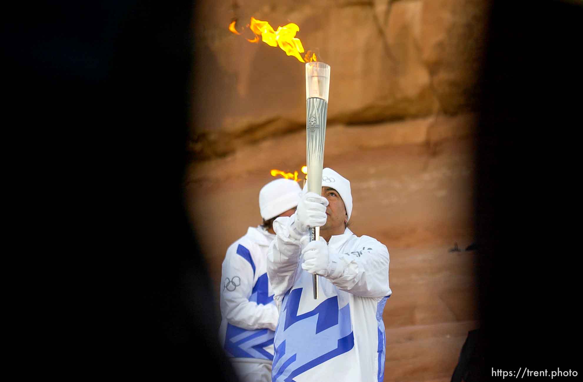 The Olympic Torch arrives in Utah, beginning with a sunrise ceremony and blessing performed by Frank Arrowchis, a member of the Whiteriver band of the Northern Ute Indian Tribe. Arrowchis then handed to torch to his 16-year-old granddaughter, Stephanie Laree Spann. 02.04.2002, 7:38:53 AM