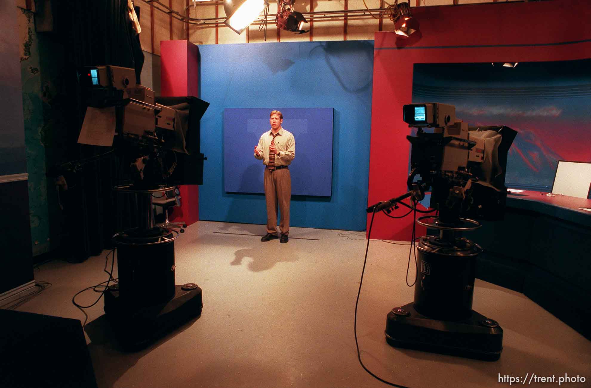 Weatherman Brandon Fullmer rehearses in an empty studio prior to the taping of a newscast at KBYU TV.