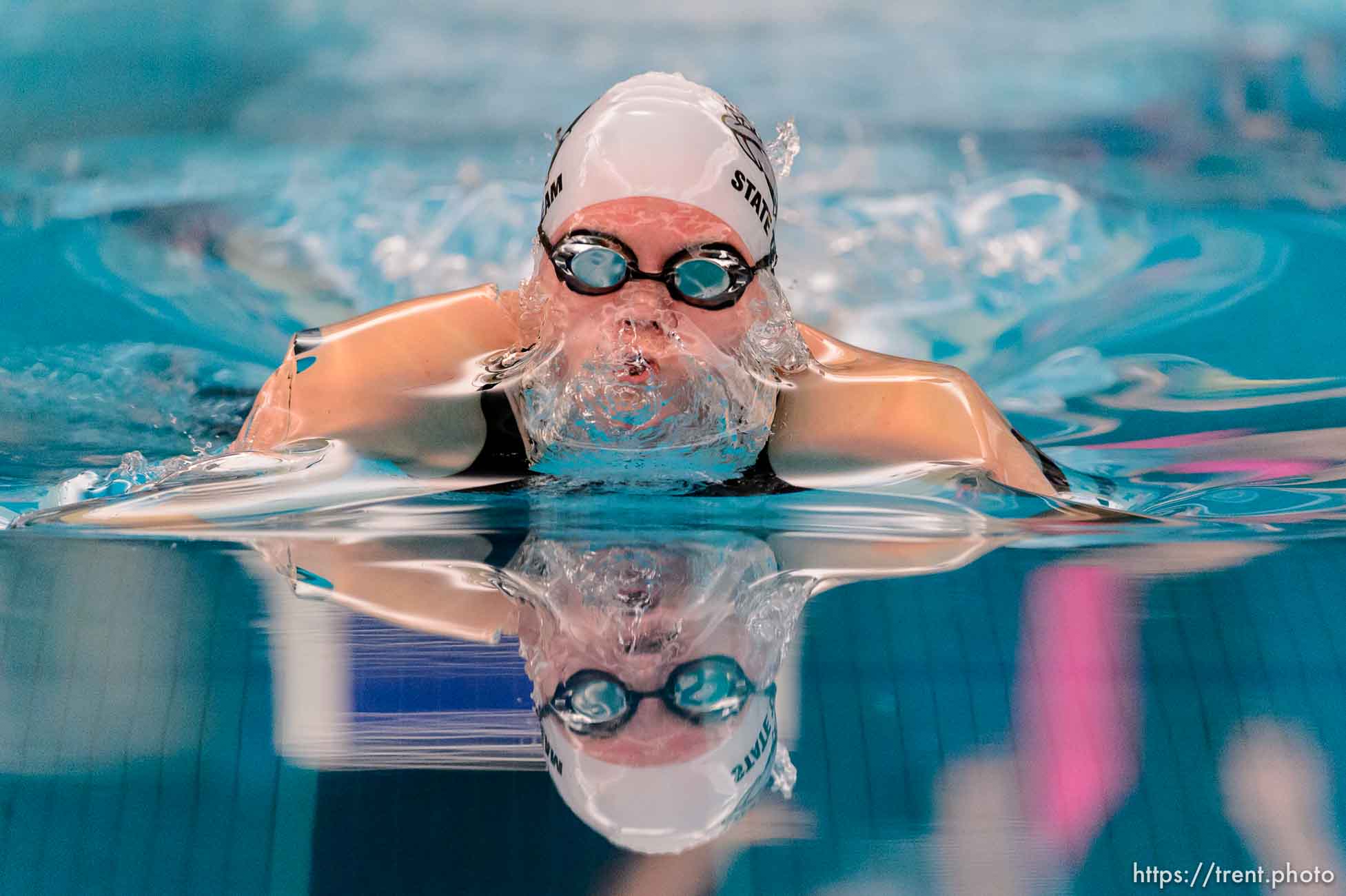 Provo's Meg Finlayson in heat 1 of the Women 100 Yard Butterfly, at the 4A state swimming championships in Provo, Saturday February 14, 2015.