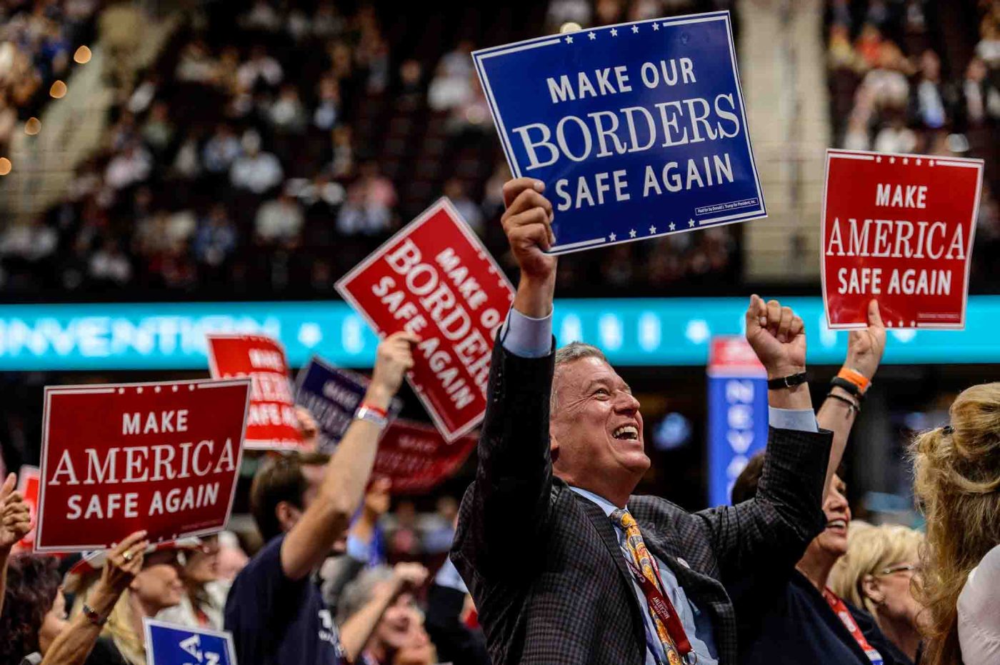 Trent Nelson  |  The Salt Lake Tribune
delegates with make our borders safe again, make america safe again signs at the 2016 Republican National Convention in Cleveland, OH, Monday July 18, 2016.