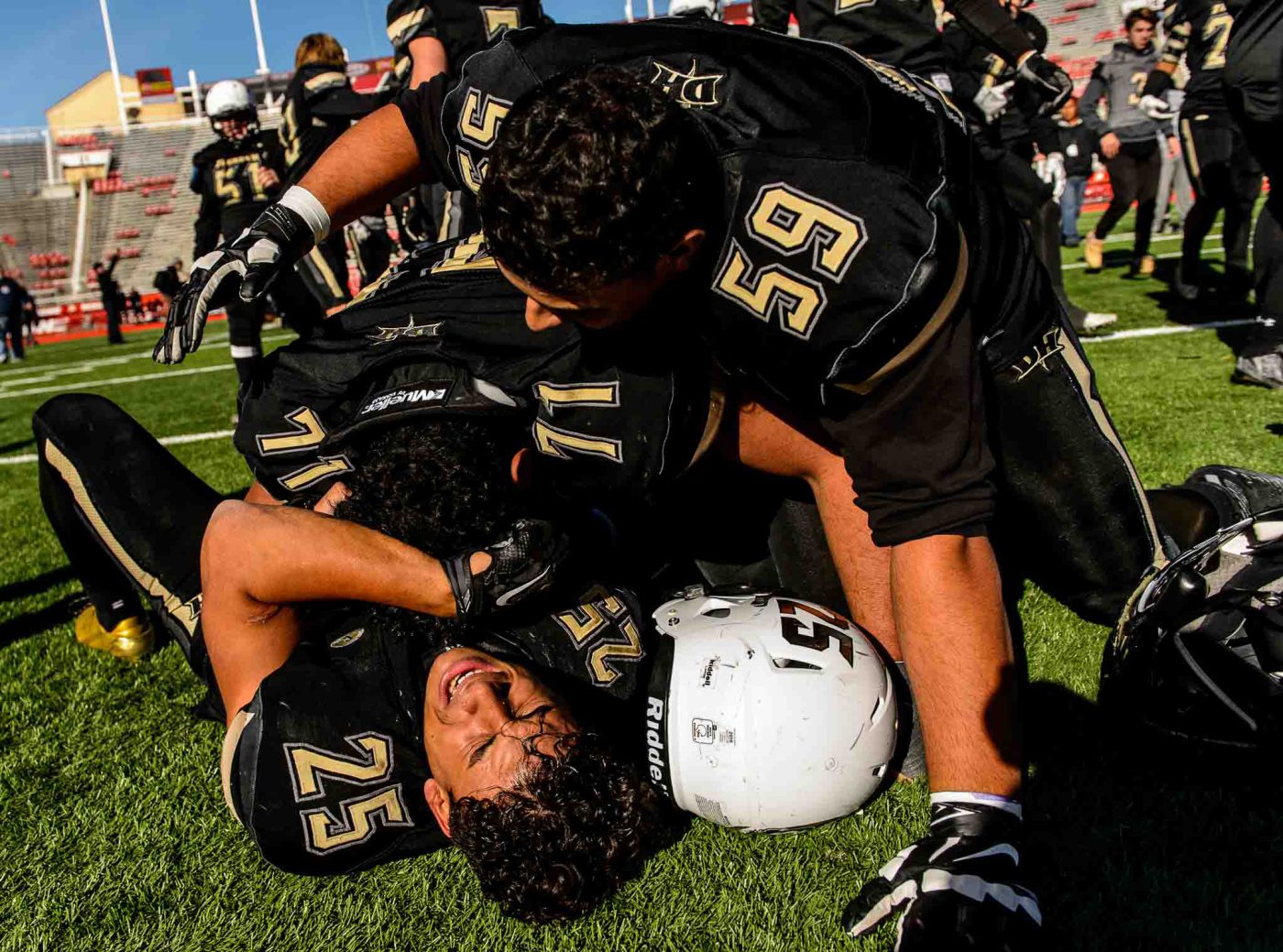 Trent Nelson  |  The Salt Lake Tribune
Desert Hills' Marco Jordan (25), Laisene Sewell (71) and Adeeb Jaouni (59) celebrate the win as Desert Hills faces Pine View in the Class 3AA high school football state championship at Rice-Eccles Stadium in Salt Lake City, Friday November 18, 2016.