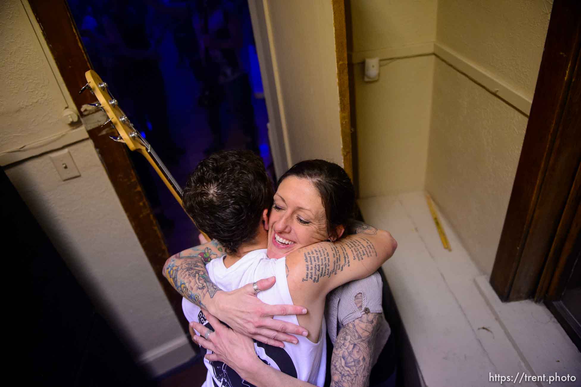 Amy Stocks embraces a musician fresh off the stage at Rock Camp for Womyn's showcase, a live performance. People attending the camp learn how to play instruments, form bands, write songs, and perform live in concert — all in three days. It's a new program by the same group that does Rock and Roll Camp for Girls. Salt Lake City, Sunday February 4, 2018.