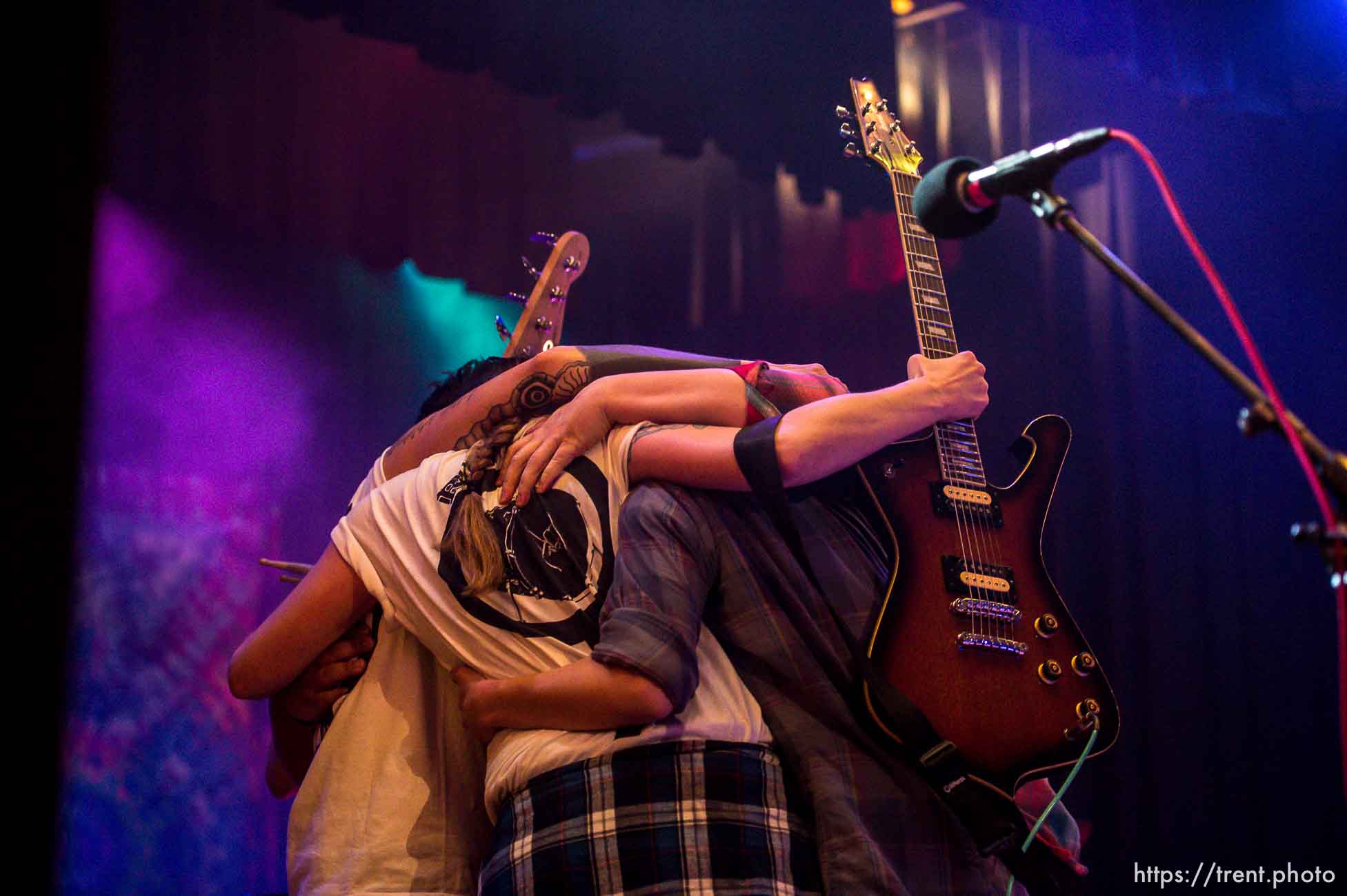 Members of the band Not Your Wife embrace after performing at Rock Camp for Womyn's showcase, a live performance. People attending the camp learn how to play instruments, form bands, write songs, and perform live in concert — all in three days. It's a new program by the same group that does Rock and Roll Camp for Girls. Salt Lake City, Sunday February 4, 2018.