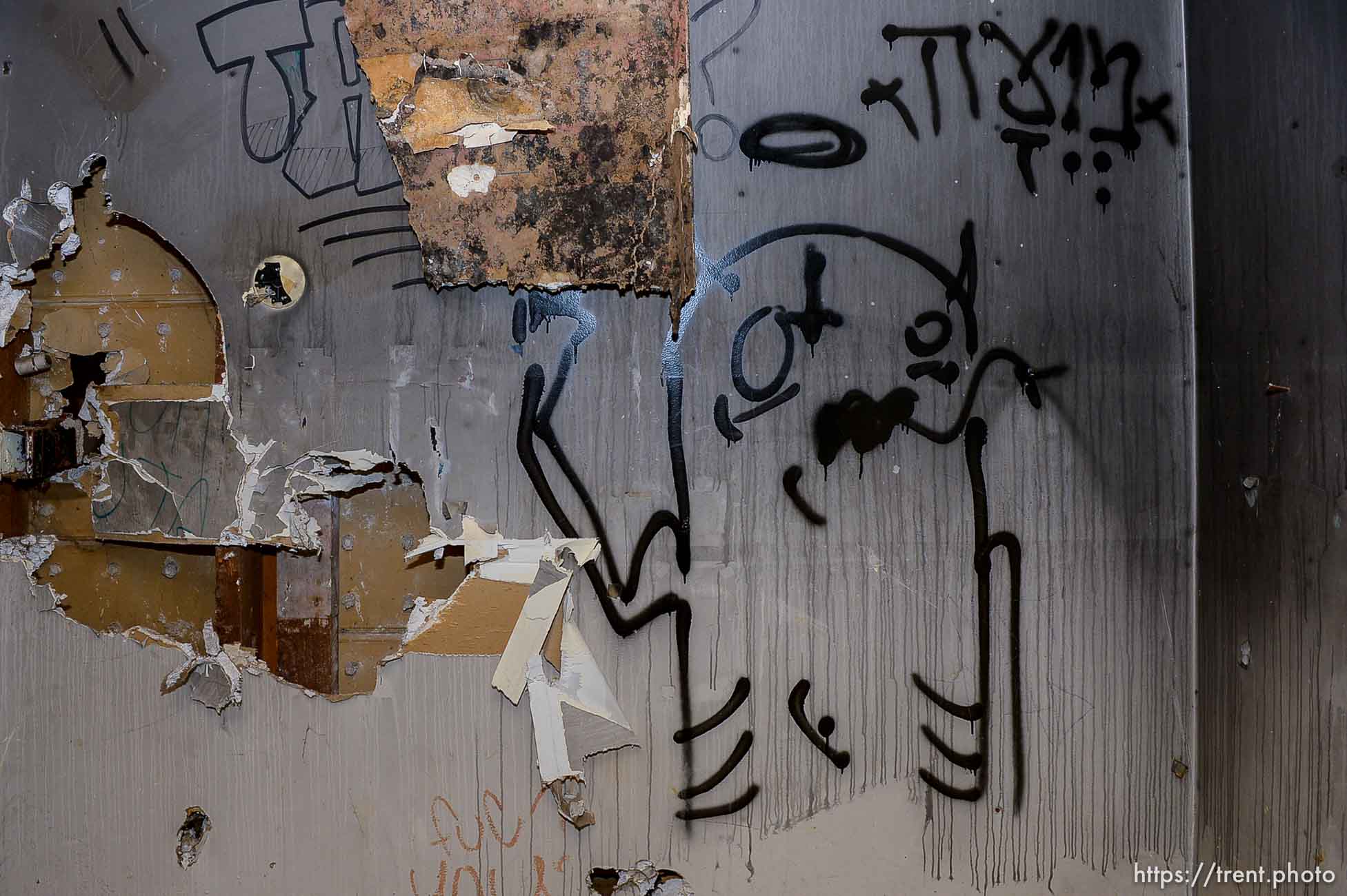 (Trent Nelson | The Salt Lake Tribune)  Graffiti in a dilapidated, fire-damaged building near 100 South 700 East in Salt Lake City, Thursday Feb. 15, 2018. Other Side Academy has received approval to demolish it for their expansion.