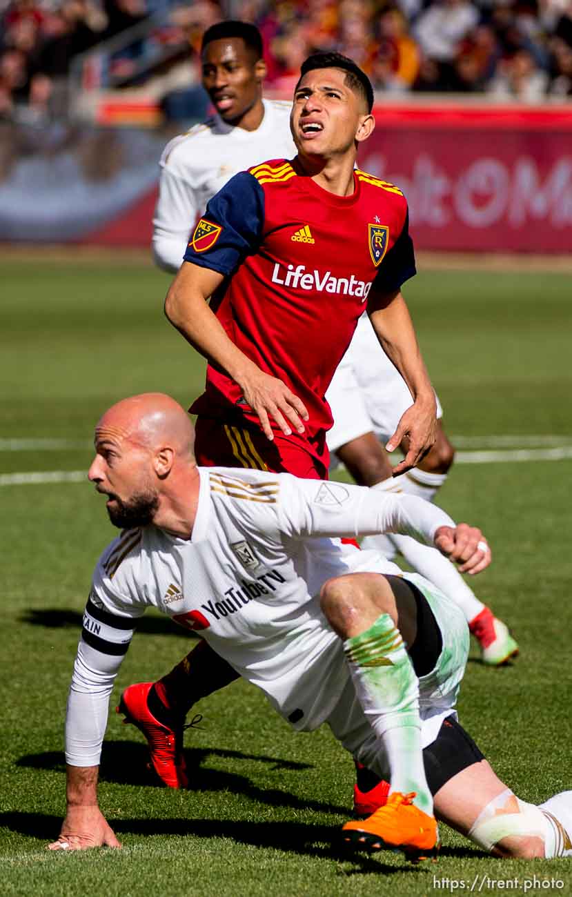 Real Salt Lake forward Jefferson Savarino (7) and Los Angeles FC defender Laurent Ciman (23) look back at the ball after Ciman defleted Savarino's shot.