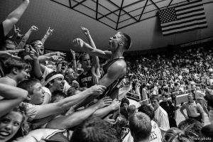 Fremont's Joel Hancock lets out a scream, celebrating Fremont's state championship win over West Jordan. At center is Fremont's Austin Raught.  Fremont vs. West Jordan, 5A state high school basketball championship game Saturday at Weber State University, Ogden.