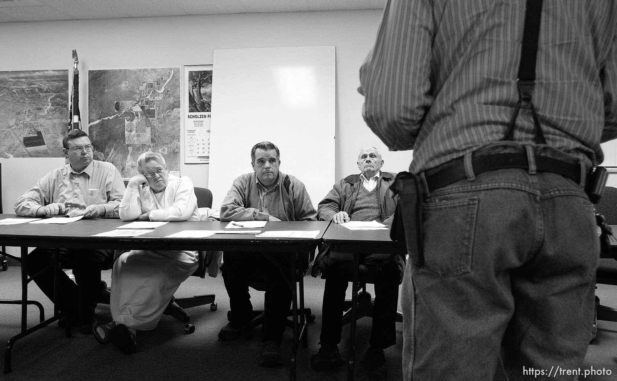 Colorado City Council left to right: Kimball Barlow (gray shirt), Karen Barlow (pink dress), Terrill Johnson, Bygnal Dutson, Floyd Black, Donald Richter.