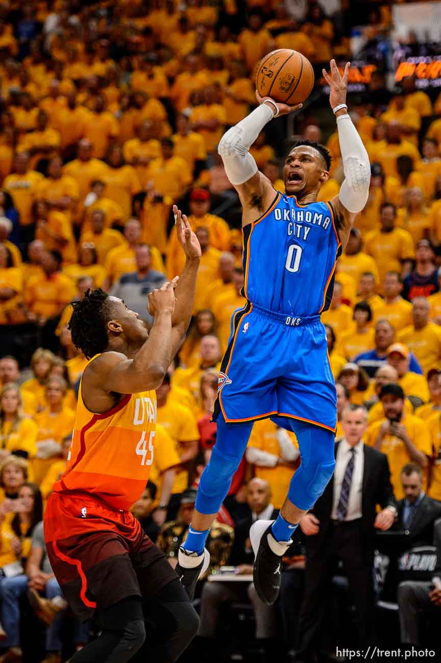 (Trent Nelson | The Salt Lake Tribune)  
Utah Jazz host the Oklahoma City Thunder, Game 3, NBA playoff basketball in Salt Lake City, Saturday April 21, 2018. Oklahoma City Thunder guard Russell Westbrook (0) shoots over Utah Jazz guard Donovan Mitchell (45).