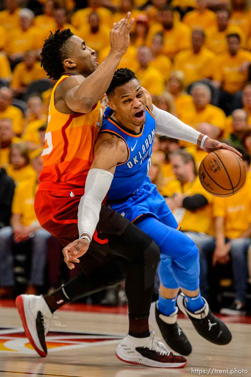 (Trent Nelson | The Salt Lake Tribune)  
Utah Jazz host the Oklahoma City Thunder, Game 3, NBA playoff basketball in Salt Lake City, Saturday April 21, 2018. Utah Jazz guard Donovan Mitchell (45) fouls Oklahoma City Thunder guard Russell Westbrook (0).