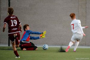 (Trent Nelson | The Salt Lake Tribune)  
Judge Memorial's Joseph Paul scores the game-winning goal against Morgan goalkeeper Trek Loveridge in the 3A state championship game, Saturday May 12, 2018.