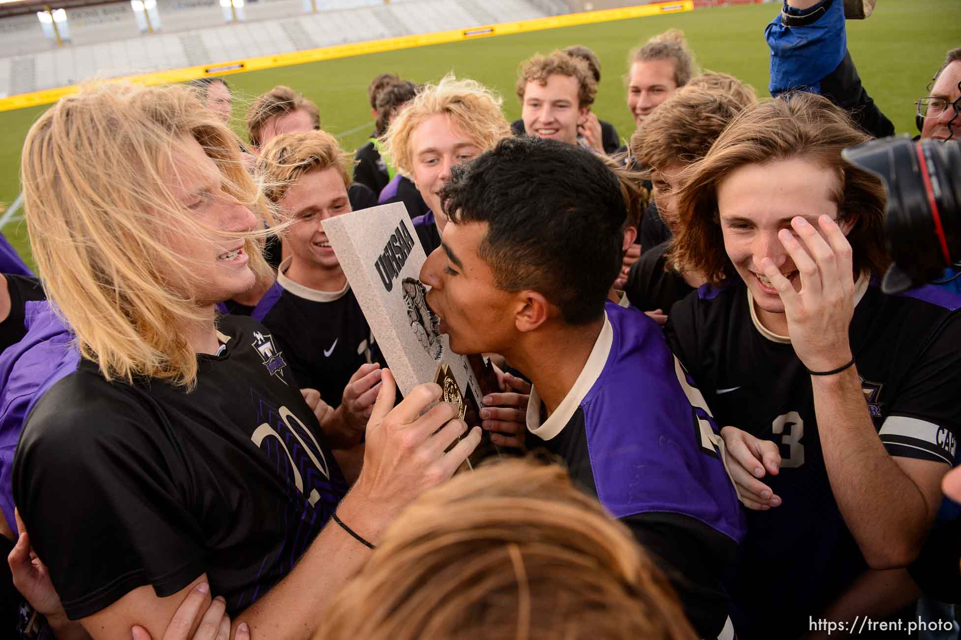 (Trent Nelson | The Salt Lake Tribune)  
Desert Hills players celebrate their win over Park City High School in the 4A state championship game, Saturday May 12, 2018.