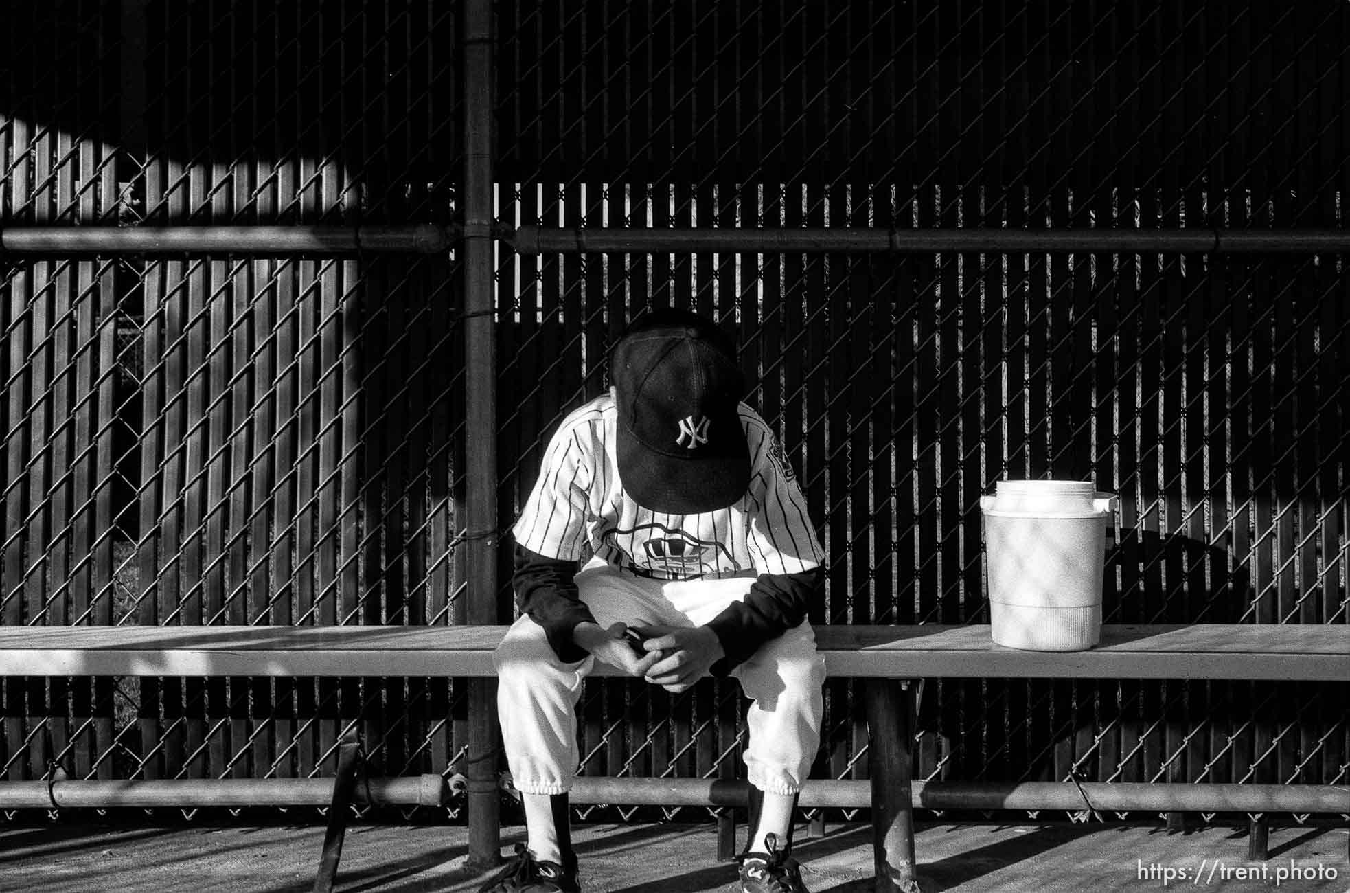 Player in dugout with head down at Yankees game