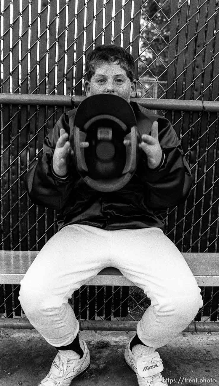 Player spinning helmet in dugout at Yankees game.